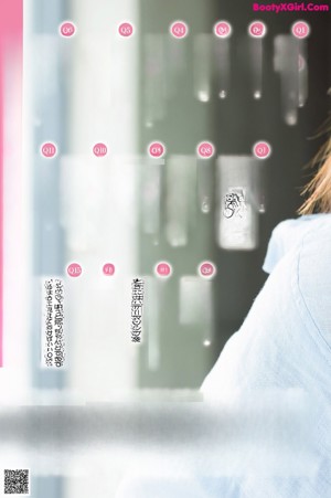 A woman sitting on a window sill looking at her cell phone.