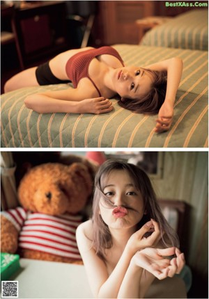 A woman laying on a bed with a teddy bear.